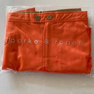 Parke & Ronen Lido swim trunks.